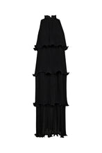 Load image into Gallery viewer, pleated tiers, this sleeveless maxi dress creates graceful movement with every step.
The high neckline is softly gathered with delicate ruffle detailing, adding a touch of romantic contrast to the architectural silhouette.
Ideal for evening occasions or elevated daytime dressing, it’s a standout piece with effortless allure.
Size & Fit
• Relaxed, flowy fit
• Full-length silhouette
• High ruffled neckline
Details
• Tiered pleated design
• Button closure at neck
• Sleeveless construction
• Lightweight fab