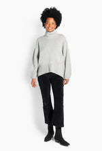 Load image into Gallery viewer, Gianna Sweater features an embroidered H patch at the hem and an oversized silhouette with a high neckline.
With wide sleeves and a longer back, it offers a relaxed yet stylish fit.
Crafted from a luxurious blend of 90% wool and 10% cashmere for softness and warmth.