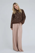 Load image into Gallery viewer, The Deer knit pullover is a knitted sweater with a bambi pattern and a soft look. The knit has a round neck, long sleeves and a relaxed fit, which makes it both comfortable and easy to style.

The elastic is true to size. The model is 175 cm tall and wears a size S/36.

- Relaxed fit
- Bambi print

Quality: 7% Wool, 49% Recycled Polyester, 21% Acrylic, 21% Nylon, 2% Spandex