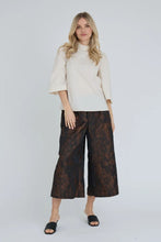 Load image into Gallery viewer, Filina blouse is a simple and feminine blouse with a stylish look. The blouse has a round neckline with ruffles, 3/4 sleeves and decorative buttons on the shoulder. The simple design makes the blouse easy to combine with both patterned trousers and skirts.

The blouse is true to size. The model is 175 cm tall and wears size S/36.

- Decorative buttons
- 3/4 sleeve length

Quality: 70% Cotton, 27% Polyamide, 3% Elastane
Washing instructions: Follow instructions on care lablel.