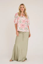 Load image into Gallery viewer, Grete s/s blouse is a feminine blouse with a floral print that gives a vibrant and summery look. It has short sleeves and a lightweight fit that falls softly. The print adds colour and character to an otherwise simple cut.

The blouse is true to size.
The model is 175 cm tall and wears

a size S/36.- Floral print
- Short sleeves
- Light and loose fit
- Summery look

Quality: 50% Cotton, 50% Polyester