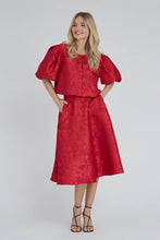 Load image into Gallery viewer, Kora skirt is a feminine midi skirt with an elegant and simple look. The skirt has a flattering fit with an A-shaped silhouette for a nice fall. The structured quality adds an exclusive look and makes the skirt obvious both on its own and with the matching Kora jacket.

The skirt is true to size. The model is 175 cm tall and wears
size S/36.

Midi length
- A-shaped silhouette
- Structured quality

Quality: 100% Polyester
Washing instructions: Follow instructions on care label