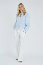 Load image into Gallery viewer, Clementine shirt is an elegant and feminine blouse in a light and airy material with beautiful, discreet embroidered details. It features long sleeves with decorative embroidery, a v-neckline with button closure and a relaxed fit for a light and sophisticated look.

The blouse is true to size.

- Long sleeves with embroidered details
- V-neckline
- Light and airy material

Quality: 100% Cotton
