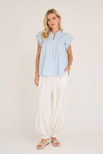 Load image into Gallery viewer, Avery top is a feminine top with ruffle details at the sleeves, which gives a light and decorative look. It has a loose fit and a simple cut that makes it easy to style with both trousers and skirts. The fine details at the shoulders add an elegant touch.

The top is normal in size.

- Top with ruffle sleeves
- Loose fit
- Feminine details
- Light and elegant look

Quality: 100% Cotton