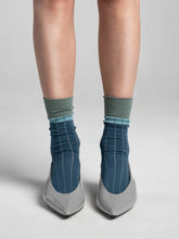 Load image into Gallery viewer, A rib with somewhere to be.

VARNA FLOW - Wide-rib knit — naturally soft, breathable and draping just right.

OEKO-TEX® certified bamboo yarn, trend-led color blocking that flows from day to night.

All our socks are produced in Georgia at our SEDEX-certified factory, ensuring responsible working conditions, high quality standards, and thoughtful production from start to finish.

Bamboo 84% / Polyamide 12% / Elastane 4%