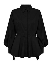 Load image into Gallery viewer, CMPOPPI-SHIRT is a shirt in a premium material with a concealed front button fastening, a folded collar, long sleeves with a cuff and elastic and a pleat at the waist. In addition, the shirt has an open back and yoke with a cloak effect for a refined look.




Concealed button fastening
Folded collar
Long sleeves with cuffs
Elasticated waistband and pleats
Open back