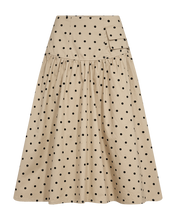Load image into Gallery viewer, CMDOTTIE-SKIRT is an A-silhouette woven cotton skirt with a soft, structured look that has a wide, double-layer waistband and subtle wrinkles. A square pocket with flap adds a playful, practical touch, while the clean silhouette is balanced by a smooth inner lining.

Woven cotton with printed dots
A-cut with wide, double-layer waistband
Front box pocket with flap and discreet gathering below the waist
Fully lined for a smooth feel
The back length is 80 cm in all sizes. 