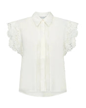 Load image into Gallery viewer, CMMOLLY-SHIRT a refined statement piece in a woven lyocell blend, detailed with sculptural 3D floral appliqués along the armholes. Its clean shirt design contrasts with the voluminous flowers, creating a bold yet feminine expression.


Premium woven lyocell blend
3D floral appliqués along armholes
Classic shirt collar with concealed button placket
Contrast between sharp tailoring and romantic volume
Back length from shoulder seam in size S is 63 cm, front length 58 cm. All measurements are indicative and ma