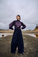 Load image into Gallery viewer, CMANNAIS-PANTS are made of stretchy raw denim with a bold, voluminous silhouette that gives a strong yet sophisticated look. The sculptural barrel legs have vertical cuts with double stitching, which gives structure and edge. The trousers are finished with a clean inner lining and metal zipper for a nice finish.


Stretchy raw denim quality
High waist with trendy, voluminous barrel legs
Vertical cutting seams with double stitching
Metal zipper in the side seam and on the inner coating

