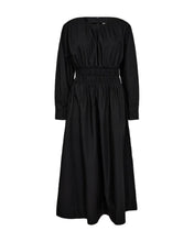 Load image into Gallery viewer, CMCRIPS-DRESS is a dress in a premium material with wide shoulders, long sleeves with adjustable cuffs, concealed back zip fastening and a smock effect that elegantly highlights the waist.

Wide shoulders
Long sleeves with cuffs
Concealed back zip fastening
Smock effect that highlights the waist
Length from shoulder in a size S is 134 cm
Note that all measurements are indicative and may vary