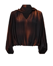 Load image into Gallery viewer, CMLAURA-BLOUSE is a loose-fitting blouse in a smooth, light viscose blend. It has a subtle balloon-shaped hem, long voluminous sleeves and a deep V-neckline with a scarf collar that falls down the back

Smooth, lightly woven viscose-rayon blend

Loose fit with a subtle balloon-shaped hem

Long, voluminous sleeves with one-button cuffs

Deep V-neckline with scarf collar designed to fall down the back