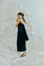 Load image into Gallery viewer, CMROSIE-TOP is a scarf top in a premium woven material with allover texture pattern. In addition, the top has narrow adjustable shoulder straps, an open back with tie fastening and hook'n eye. The elongated back pieces creates an elegant cloak effect.


Allover textured pattern
Narrow adjustable shoulder straps
Open back with tie closure and hook'n eye
Elongated back pieces
Elegant cloak effect