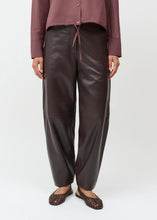 Load image into Gallery viewer, Nisaki Leather Trousers by Créton

Details

Soft trousers in genuine nappa leather
Curved silhouette with extra volume through the legs
Distinctive panel stitching at the knees
Slanted side pockets and discreet piped pockets at the back
Dark brown shade with an exclusive and timeless look
