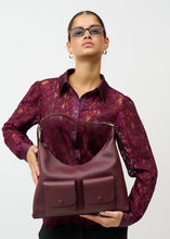 Load image into Gallery viewer, Lace design throughout with decorative floral motifs
Classic shirt collar and button closure
Long, sheer lace sleeves with wide cuffs
Elegant wavy lace hem