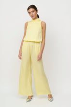 Load image into Gallery viewer, CRETON Zublini jumpsuit is a feminine and sophisticated choice that can be styled both up and down. Wear it with heels and an elegant clutch for festive occasions, or style it with flat sandals and a light blazer for a more casual yet stylish look. The clean silhouette and the fine ruffle details give it an exclusive look that makes it suitable for both summer parties, dinners and special events.

Sleeveless jumpsuit
High neck with fine ruching details
Small ruffles at armholes
Elastic waist 