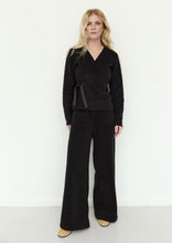 Load image into Gallery viewer, Classic HSCPH fleece trousers with a refined new twist. The flattering flared legs create a relaxed and balanced silhouette, while the versatile length sits naturally between styles 2116 and 2115. Designed with front pockets and an adjustable waistband for everyday comfort and ease. Comfortable and uncomplicated to wear, they combine relaxed styling with a clean and modern expression.
