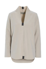 Load image into Gallery viewer, A refined blouse in HSCPH’s signature fleece, designed with a feminine silhouette and thoughtful details. The curved hem and longer back create a soft and flattering shape, while the V-neck with a small collar finish adds an elegant touch. Lightweight and comfortable to wear, it is designed for relaxed everyday dressing with a polished feel. Finished with signature grosgrain band details that highlight the HSCPH design DNA.
Style it with matching fleece trousers for a calm tonal look.