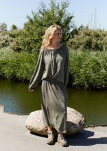 Load image into Gallery viewer, NORMAL FIT - CHECK STYLE GUIDE
Crafted from soft viscose jersey, this skirt features a wide, concealed elastic waistband for a smooth and comfortable fit. The waistband enhances comfort while allowing the fabric to drape beautifully.
Designed with an elegant ankle-length silhouette that moves effortlessly with the body.
Style it with the matching top for a complete look.
- 100% EU production
- 96% viscose ECOVERO™, 4% EA
- OEKO-TEX® STANDARD 100 cert. no. 2176-347 DTI
- Machine wash, hang to dry