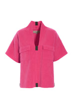Load image into Gallery viewer, A relaxed fleece blouse with short sleeves, a flattering V-neck, and a boxy silhouette. Designed with chest pocket details and finished with the signature Henriette Steffensen grosgrain band for a refined touch.
Style it with your favorite jeans and chunky boots for a cool everyday look.
- 100% EU production
- 70% polyester min. 50% recycled
- 30% viscose
- OEKO-TEX® STANDARD 100 cert. no. 2176-347 DTI
- Machine wash and hang to dry, ready to wear after a few hours