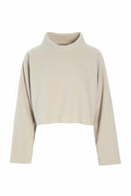 Load image into Gallery viewer, A cropped fleece blouse with a soft roll neck. This long-sleeved pullover features a cropped silhouette, perfect as a second layer over a top or dress, or paired with high-waisted trousers or skirts.
The design combines comfort, functionality, and style, making it a versatile addition to your wardrobe.

- 100% EU production
- 70% polyester min. 50% recycled
- 30% viscose
- OEKO-TEX® STANDARD 100 cert. no. 2176-347 DTI
- Machine wash, hang to dry