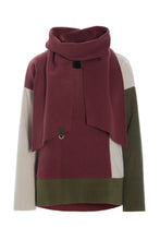 Load image into Gallery viewer, A relaxed blouse&nbsp; with scarf in HSCPH’s signature fleece, designed with balanced&nbsp; colour combinations. The straight boxy silhouette creates a modern and effortless shape, while the length low the hips adds comfort and ease. Lightweight and uncomplicated to wear, it combines artistic expression with calm everyday dressing. A statement piece designed to stand out in a refined way.
Style it with fleece trousers or denim to let the colours take focus. An easy layer for everyday wear across seasons.