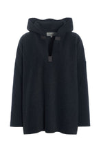 Load image into Gallery viewer, A relaxed hoodie in HSCPH’s signature fleece, designed with an oversized silhouette and soft drape. The V-neck and signature grosgrain details add a refined balance to the relaxed shape, creating a look that feels both casual and considered. Warm, lightweight and uncomplicated to wear, it is designed for comfort without feeling heavy. A calm everyday piece with versatile styling possibilities.
Style it with matching fleece trousers for a relaxed tonal look or pair it with a long jersey skirt