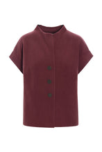 Load image into Gallery viewer, This soft vest is perfect for in-between seasons to keep warm. Wear it over a nice shirt and close it with a belt, for a more feminine look. You can choose between different colours and the boxy shape makes this vest suitable for both casual and everyday wear.

- 100% EU production
- 70% polyester min. 50% recycled
- 30% viscose
- OEKO-TEX® STANDARD 100 cert. no. 2176-347 DTI
- Machine washable - wear again after few hours.