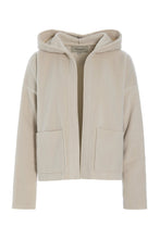 Load image into Gallery viewer, A cardigan with a more sporty look, designed with long sleeves, practical pockets, and a hood. The boxy, cropped silhouette creates a relaxed and modern feel.
Style it with matching fleece pants, a jersey T-shirt, and your favourite sneakers for a comfortable everyday look.
- 100% EU production
- 70% polyester min. 50% recycled
- 30% viscose
- OEKO-TEX® STANDARD 100 cert. no. 2176-347 DTI
- Machine wash and hang to dry, ready to wear after a few hours
