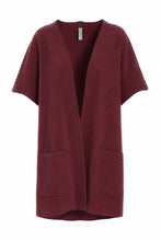 Load image into Gallery viewer, NORMAL FIT
An elegant vest with a straight, loose fit, designed with side slits and large arm openings for easy layering. Cut to a perfect mid-length and finished with pocket details and our signature grosgrain band for a refined touch.
A versatile piece that works across all seasons – perfect for layering over a dress on a breezy summer evening or worn over a sweater when the temperature drops.
- 100% EU production
- 70% polyester min. 50% recycled
- 30% viscose
- OEKO-TEX® STANDARD 100 cert. no. 217