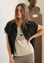 Load image into Gallery viewer, A classic, soft basic T-shirt made from our specially developed viscose jersey that feels light on the skin but has enough weight to create the perfect drape.
This style includes thoughtful details like gentle folding on the sleeves and a slightly longer back, adding subtle character to a simple silhouette.
An easy piece to wear on its own or layered into your everyday look.