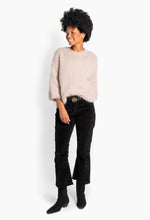 Load image into Gallery viewer, A soft and airy knitted sweater with a relaxed fit and slightly voluminous sleeves. The classic round neck and fluffy texture give the sweater a timeless and feminine look. A comfortable favourite that can easily be styled throughout the autumn and winter season
