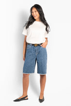 Load image into Gallery viewer, The Dharma Shorts are designed with a relaxed, knee-length silhouette and a clean, structured feel. Crafted in soft denim, they offer comfortable wear with a natural drape.

Featuring classic five-pocket styling, subtle HÉST-inspired pattern detailing, and raw-cut hems for a casual finish. A versatile style that adds a refined edge to warm-weather denim looks.