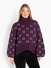 Load image into Gallery viewer, HÉST Fam Sweater Short Potent Purple;Best-selling signature sweater, loved for its relaxed fit and timeless elegance. Knitted in a soft and exclusive fabric, designed with a high neck, voluminous sleeves and a characteristic H-pattern that gives a modern and sophisticated look. With a flattering length at the front and slightly longer length at the back, an elegant silhouette is created. Light, soft and comfortable - a sweater you will want to wear again and again.