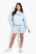 Load image into Gallery viewer, Casual sweat shorts with a clean, minimalist look and a comfortable elastic waist with drawstring. Crafted from soft French Terry cotton for a relaxed fit and adorned with a subtle tone-on-tone HÉST logo on the leg. Simple and versatile, perfect for casual days with a sophisticated, modern feel.

Material: 80% Cotton &amp; 20% Polyester