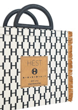 Load image into Gallery viewer, “Hést’s stylish new bag with the H logo! A design that makes you stand out with elegance. There is a hard bottom you can choose to have inside the bag if you wish, and also a leather strap if you want to wear it on your shoulder. 