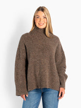 Load image into Gallery viewer, HÉST Noelle Sweater Brown. Lovely high-necked sweater knitted in solid wool - and mohair blend. The sweater has an oversized fit with long wide sleeves, slits in the sides and a large embroidered H at the bottom left side.&nbsp;