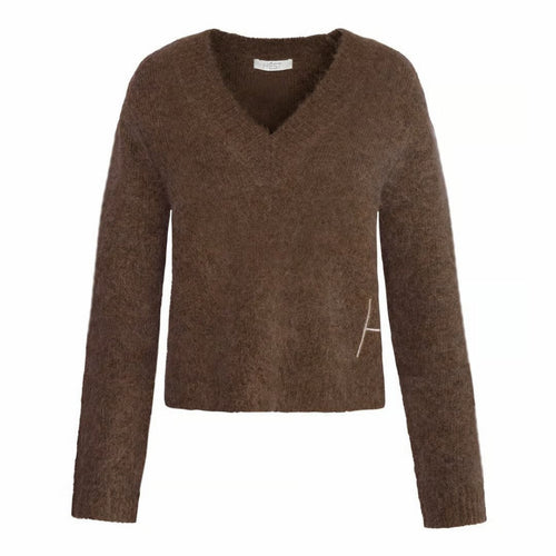 Pernille Sweater features a soft V-neck and refined rib detailing, finished with subtle H embroidery at the hem. Crafted from a cosy alpaca wool blend for warmth and softness. A timeless knit with an effortless, elevated feel.