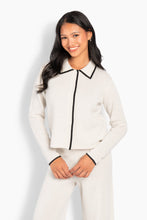 Load image into Gallery viewer, The Vivienne Cardigan is designed with a clean, structured silhouette and a soft, refined feel. Crafted from merino wool, it offers warmth while remaining lightweight and comfortable. Finished with a classic collar and contrast piping along the front and edges for a subtle, graphic touch. A versatile piece that works equally well styled on its own or layered for a more polished look.