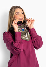 Load image into Gallery viewer, An elegant silk scarf crafted from smooth, lightweight silk with a fluid drape. Designed with graphic pattern and refined border detailing, it adds a polished touch of colour and texture. Versatile and timeless, it’s a refined accessory to elevate both everyday and occasion looks.