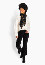 Load image into Gallery viewer, A generously sized wool scarf designed to combine warmth with bold, modern elegance. Featuring HÉST’s signature H pattern and refined border detailing, it creates a graphic yet sophisticated expression. Light and airy while still offering comforting warmth, it drapes beautifully over the shoulders or around the neck. A statement accessory that adds depth, contrast, and a contemporary edge to everyday styling.