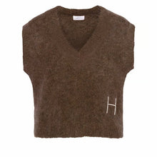 Load image into Gallery viewer, This relaxed V-neck vest is crafted from a soft alpaca blend for a warm, cosy feel.
Featuring ribbed details and raw edges for a modern, textured look.
A contemporary layering piece that brings edge to everyday styling.