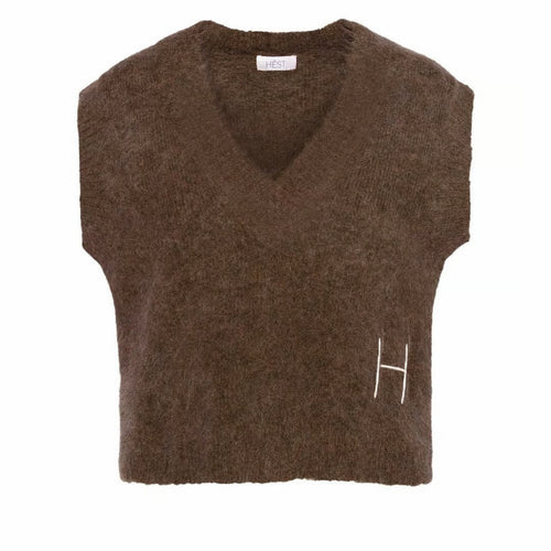 This relaxed V-neck vest is crafted from a soft alpaca blend for a warm, cosy feel.
Featuring ribbed details and raw edges for a modern, textured look.
A contemporary layering piece that brings edge to everyday styling.