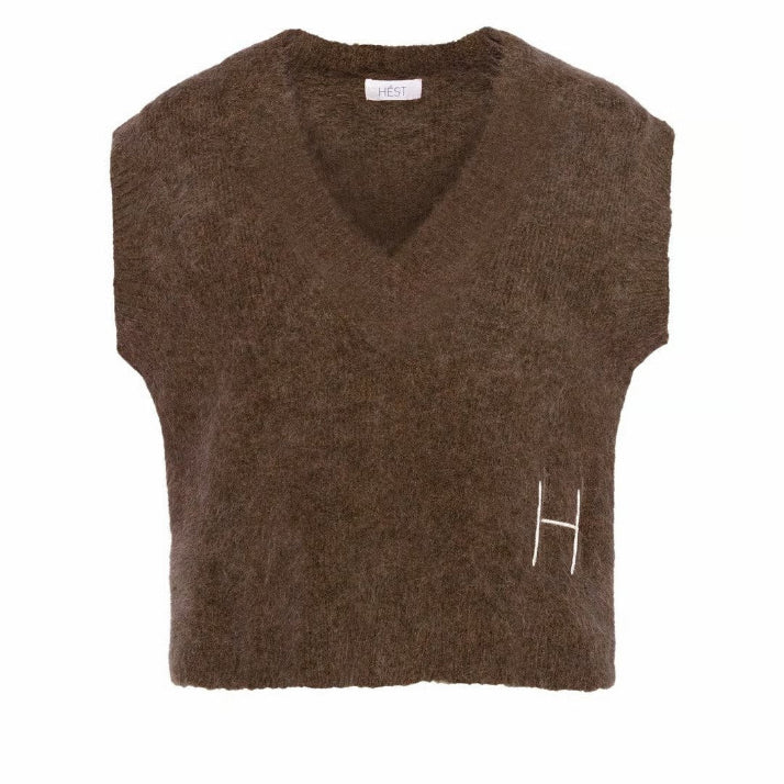 This relaxed V-neck vest is crafted from a soft alpaca blend for a warm, cosy feel.
Featuring ribbed details and raw edges for a modern, textured look.
A contemporary layering piece that brings edge to everyday styling.