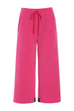 Load image into Gallery viewer, Fleece pants with flair legs in mid-calf length. The pants have pockets in the sides and ties in the front.

Guaranteed to become a favourite in your wardrobe, these pants are extremely versatile and can be styled for multiple occasions. Use them with a sweater and boots for a comfortable and relaxed look, or style them with heels and stockings for festive occasions. They can also be worn as casual wear at home, on lazy Sunday mornings.

Model info: Height 172 cm, chest 80 cm, waist 61 cm, hips 92 cm. The m