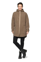 Load image into Gallery viewer, A soft pile jacket with a large hood, keeping you warm without feeling heavy.

Comfort and modern design come together in this soft pile jacket, made for cosy, easy days. A large hood and elastic binding at all hems keep the fit relaxed and comfortable, while a decorative grosgrain front zipper sets a refined tone. Square pockets with grosgrain details and neat flatlock stitching add a polished finish throughout. The gently rounded hemline at the back enhances the feminine silhouette.