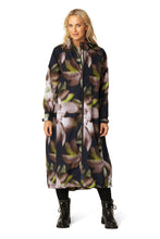 Load image into Gallery viewer, A long, lightweight raincoat with a generously cut silhouette and raglan sleeves for ease of movement. Showcasing a bold all-over floral print, it combines function with statement style. Adjustable hood and sleeve cuffs ensure extra all-weather protection, while the YKK 2-way Aqua-Guard zipper and discreetly concealed zipped pockets maintain a clean, streamlined look. Black trims add a minimalistic, urban touch. Crafted from a light 2-layer fabric with a TPU membrane, it provides 8.000 mm waterproof protect