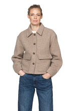 Load image into Gallery viewer, This short buttoned jacket with patch pockets has a water-repellent coating, a soft inner lining, and a large collar for a refined, classic look. Front horn buttons with an engraved logo add a branded touch, while the large stitched pockets bring a uniform-inspired design detail. A center-back pleat enhances movement and adds a sophisticated finish.

Materials:

Composition: 70% Polyester, 30% Wool
Lining: 100% Polyester
No padding