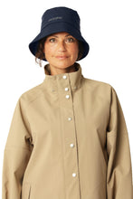 Load image into Gallery viewer, This rain hat is the perfect accessory to brighten up your rainy days outfit. The hat packs easily - so you are always prepared. The quality is a light polyester jersey with PU coating lined with a light cotton-blend fabric. Reflective logo at c.f. The style is available in both classic and seasonal colours.
