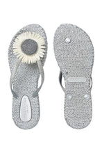 Load image into Gallery viewer, Step into summer with effortless elegance. These charming flip-flops combine beauty and comfort in one light, flexible design—ideal for beach walks, garden gatherings, or warm days in the city. A shimmering thong strap and bold decorative flower elevate this casual essential into a feminine statement piece. With their air-infused sole and gentle massage effect, they’re designed to keep your feet happy all day long.

Lightweight sole with induced air for flexibility and comfort
Structured sole 