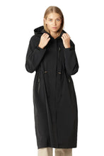 Load image into Gallery viewer, A functional and feminine long raincoat made for active, all-weather lifestyles. Cut from durable ripstop fabric with a soft shine, and treated with Ecorepel® for long-lasting water and dirt repellency, this style offers dependable protection in medium to heavy rain conditions.

The design is finished with an adjustable hood with elasticated edge, AquaGuard® zippers, and a flattering curved hem that dips slightly longer at the back. A storm placket shields the front closure, while a discreet slit at the cen
